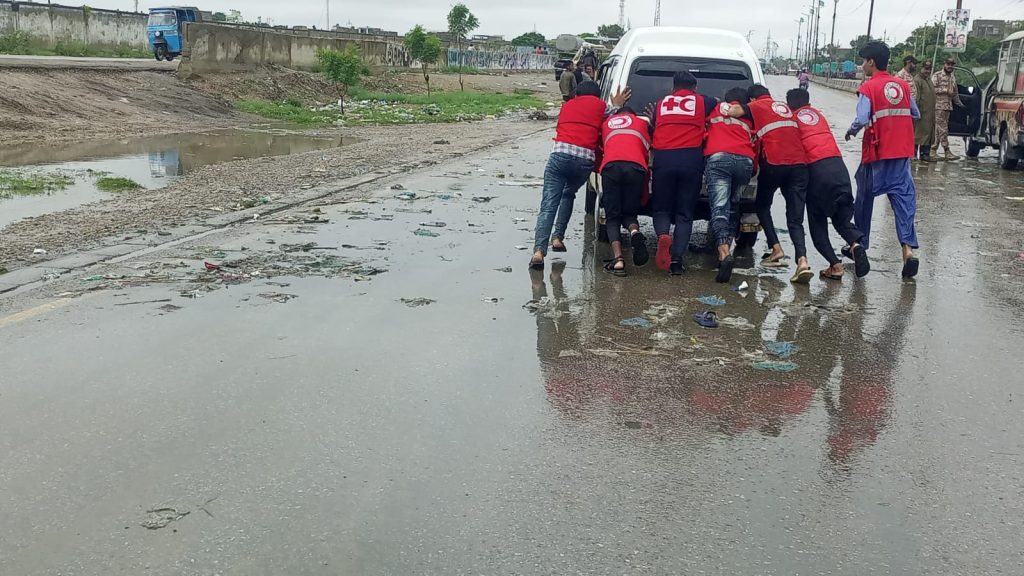 Pakistan Red Crescent Sindh volunteers supporting affected people in urban flooding"