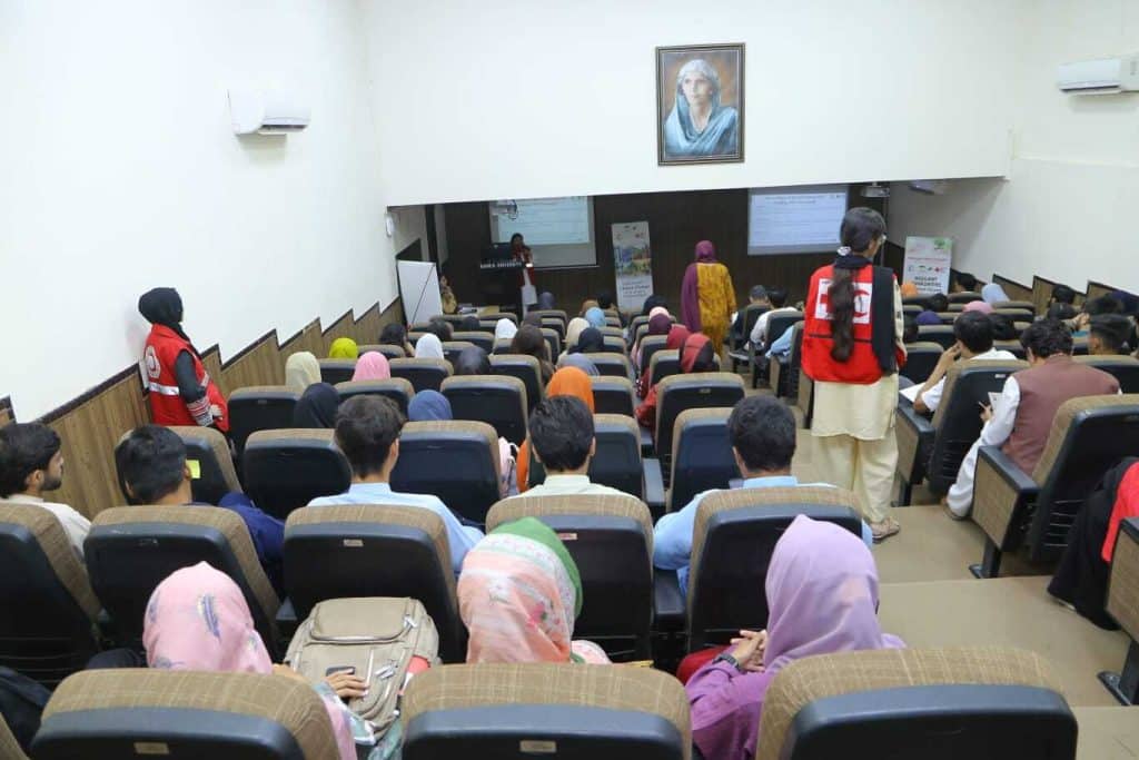Mr. Sibtain Jawed delivering a presentation on leveraging AI for Green Tech and climate resilience at PRCS Sindh and Bahria University event