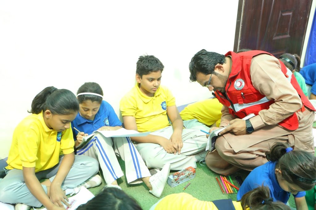 Children participating in drawing and coloring competition on climate change