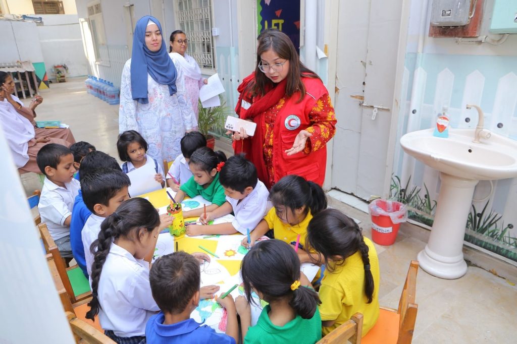 Children participating in drawing and coloring competition on climate change