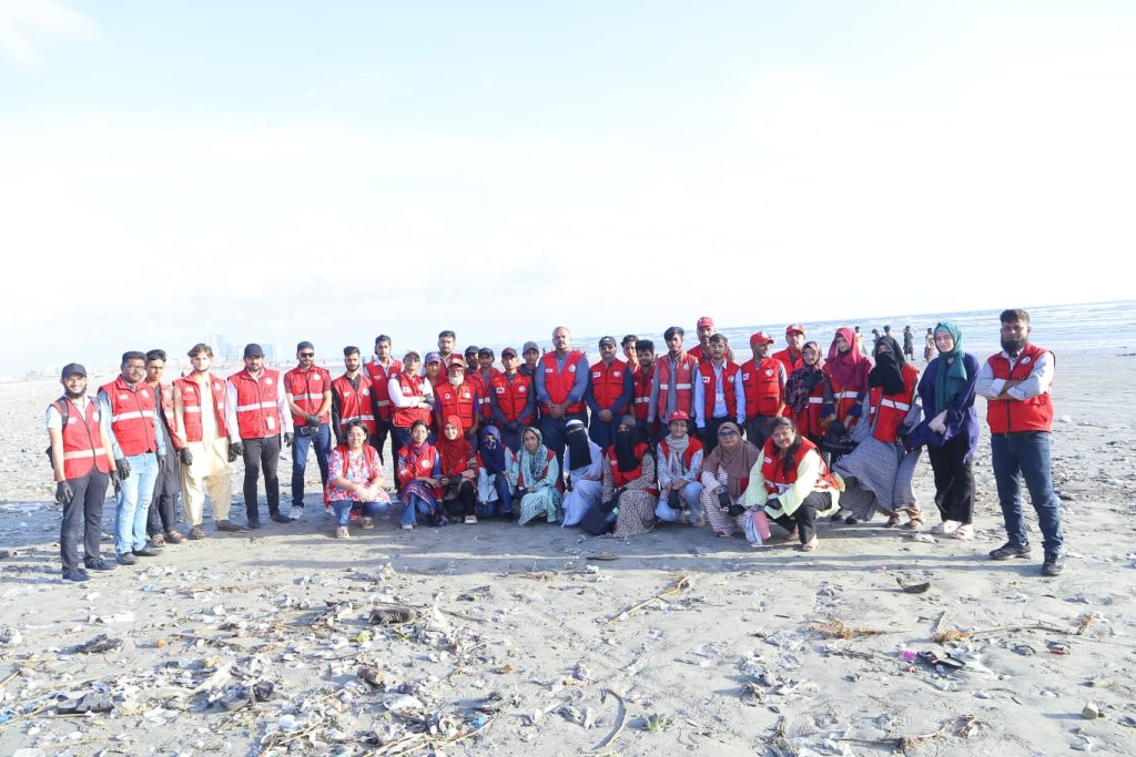 PRCS Sindh volunteers cleaning Sea View Clifton beach during large-scale drive