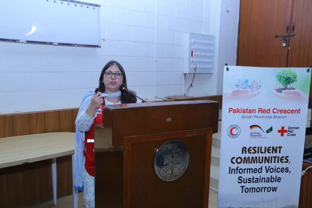 Speakers presenting on health impacts of climate change at JMDC auditorium