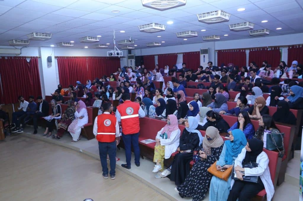 Speakers presenting on health impacts of climate change at JMDC auditorium