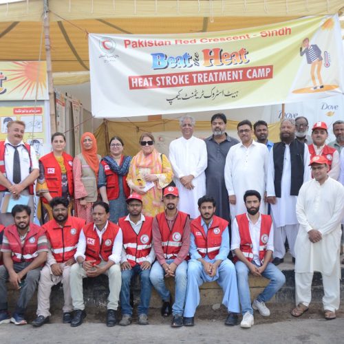 PRCS team offering first aid and hydration services to heatwave-affected community